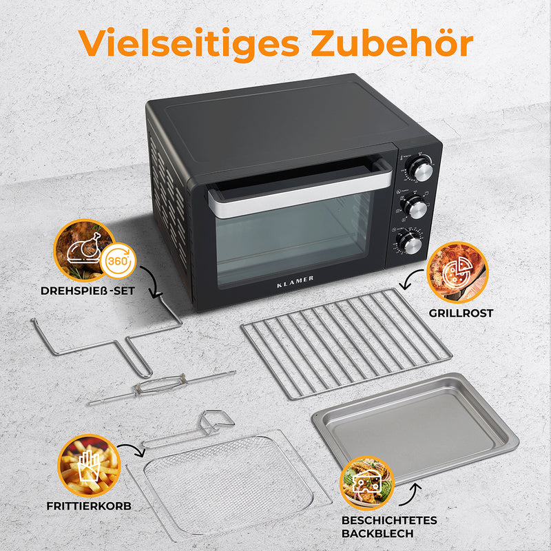 Mini-Backofen mit vielseitigem Zubehör wie Drehspieß-Set, Grillrost und Frittierkorb auf einem Tisch.
